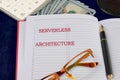 Concept words SERVERLESS ARCHITECTURE written in a business notebook, a conceptual photo Royalty Free Stock Photo
