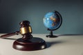 Concept of world justice. Wooden judge gavel and globe Royalty Free Stock Photo