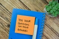 Concept of You Have Questions We Have Answers write on sticky notes isolated on Wooden Table