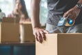 Close-up hand of woman use tape sealing cardboard box Royalty Free Stock Photo