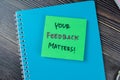 Concept of Your Feedbak Matters! write on sticky notes isolated on Wooden Table Royalty Free Stock Photo