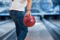 Conception of bowling. Rear particle view of man in casual clothes in the club
