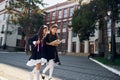 Conception of friendship. Two schoolgirls is outside together near school building Royalty Free Stock Photo