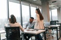 Conception of teamwork. Four people are in the office together