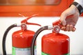 Engineer are checking and inspection a fire extinguishers tank in the fire control room for safety training and fire prevention. Royalty Free Stock Photo