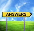 Conceptual arrow sign against beautiful landscape with text - ANSWERS Royalty Free Stock Photo