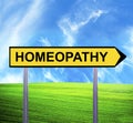 Conceptual arrow sign against beautiful landscape with text - HOMEOPATHY