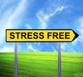 Conceptual arrow sign against beautiful landscape with text - STRESS FREE Royalty Free Stock Photo