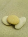 Conceptual background of three small soft colored pebbles looks very unique
