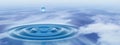Conceptual blue liquid drop falling in water with ripples and waves banner Royalty Free Stock Photo
