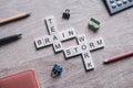 Conceptual business keywords on table with elements of game making crossword Royalty Free Stock Photo