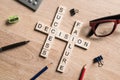 Conceptual business keywords on table with elements of game making crossword Royalty Free Stock Photo