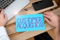 Conceptual caption Customer Acquisition. Word Written on it refers to gaining new consumers to the business Woman Typing