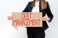 Writing displaying text Debt ManagementThe formal agreement between a debtor and a creditor. Internet Concept The formal