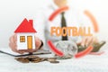 Conceptual caption Football. Business overview any of various forms of team game involving kicking a ball New home Royalty Free Stock Photo