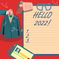 Conceptual caption Hello 2022. Word for Hoping for a greatness to happen for the coming new year Hands Holding Uniform