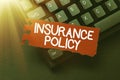 Conceptual caption Insurance Policy. Business approach document detailing the terms and conditions of a insurance Typing Royalty Free Stock Photo