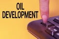 Conceptual caption Oil Development. Internet Concept act or process of exploring an area on land or sea for oil Hands Royalty Free Stock Photo