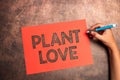 Conceptual caption Plant Love. Business approach a symbol of emotional love, care and support showed to others Writing Royalty Free Stock Photo