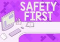 Conceptual caption Safety First. Concept meaning used to say that the most important thing is to be safe Office Desk