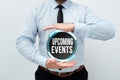 Writing displaying text Upcoming Events. Business approach a planned public or social occasion happening soon Presenting Royalty Free Stock Photo