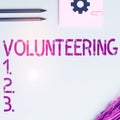 Text showing inspiration Volunteering. Business showcase Provide services for no financial gain Willingly Oblige