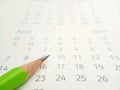 Conceptual Close up, Illustration for start to mark a schedule using green pencil at calendar Royalty Free Stock Photo