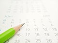 Simple Photo Conceptual Close up, Illustration for start to mark a schedule using green pencil at calendar Royalty Free Stock Photo