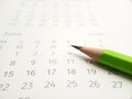 Simple Photo Conceptual Close up, Illustration for start to mark a schedule using green pencil at calendar Royalty Free Stock Photo