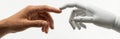 Human Hand Touching Robotic Fingers. Connection Between Man and Machine. Royalty Free Stock Photo