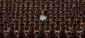 Conceptual collage with crowd of identical people with same emotions and one different young girl, difference and Royalty Free Stock Photo