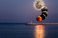 Conceptual compoite image of the stages of the largest lunar eclipse of 21 century. Royalty Free Stock Photo