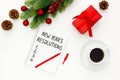 Conceptual composition  table with , notebook with plans for the year and Christmas decorations. Royalty Free Stock Photo