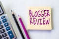 Hand writing sign Blogger Review. Business approach making a critical reconsideration and summary of a blog Plain Spiral