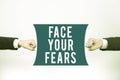 Conceptual display Face Your Fears. Word for Strong and confident to look into the future to success Important