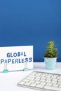 Conceptual display Global Paperlessgoing for technology methods like email instead of paper. Business overview going for Royalty Free Stock Photo
