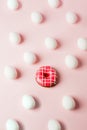 Conceptual easter egg background with pink donut on pink pastel background