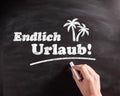 Conceptual Endlich Urlaub Texts on Chalkboard Royalty Free Stock Photo