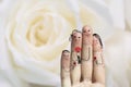 Conceptual family finger art. Father, son and daughter are giving flowers their mother. Stock Image