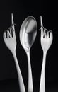 Conceptual figure of a spoon and two curved forks