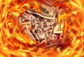 Conceptual finance image of burning pile dollar bill and fire fl