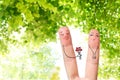 Conceptual finger art of a Happy couple. Man is giving a bouquet. Stock Image