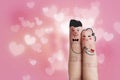 Conceptual finger art of a Happy couple. Man is giving a ring. Stock image