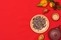 Conceptual flat lay Chinese New Year food and drink still life. Royalty Free Stock Photo