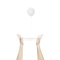 Conceptual freedom image of a white balloon escaping from a human trap