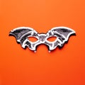 Bat-mask and vampire fangs on an orange background Royalty Free Stock Photo