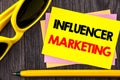 Conceptual hand text showing Influancer Marketing. Business photo showcasing Social Media Online Influence Strategy written on Sti Royalty Free Stock Photo