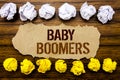 Conceptual hand text word Baby Boomers. Business concept for Demographic Generation Written on sticky note, wooden with sticky, ma Royalty Free Stock Photo