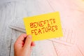 Conceptual hand writing showing Benefits Features. Business photo showcasing Making a product stand out from the crowd Value of it Royalty Free Stock Photo