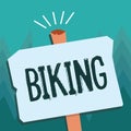 Conceptual hand writing showing Biking. Business photo showcasing ride bicycle or motorcycle Delievering package Royalty Free Stock Photo